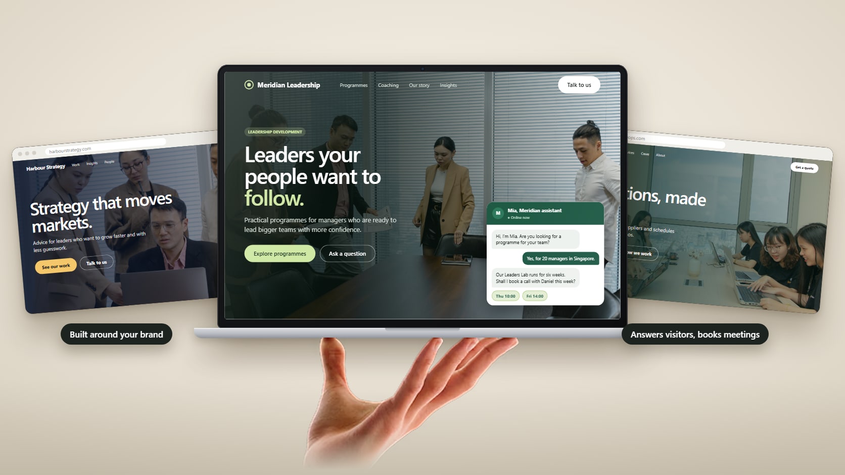A laptop and a phone showing a leadership training website with an AI assistant chatting to a visitor and booking a call, with a new enquiry notification.