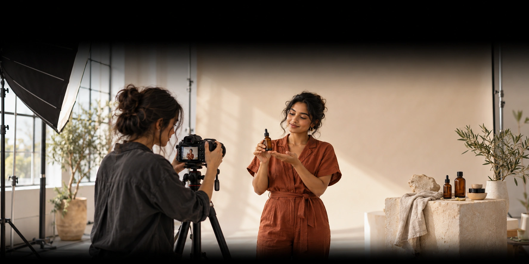 Illustration of a brand owner presenting a skincare product while a content creator films in a daylight studio.